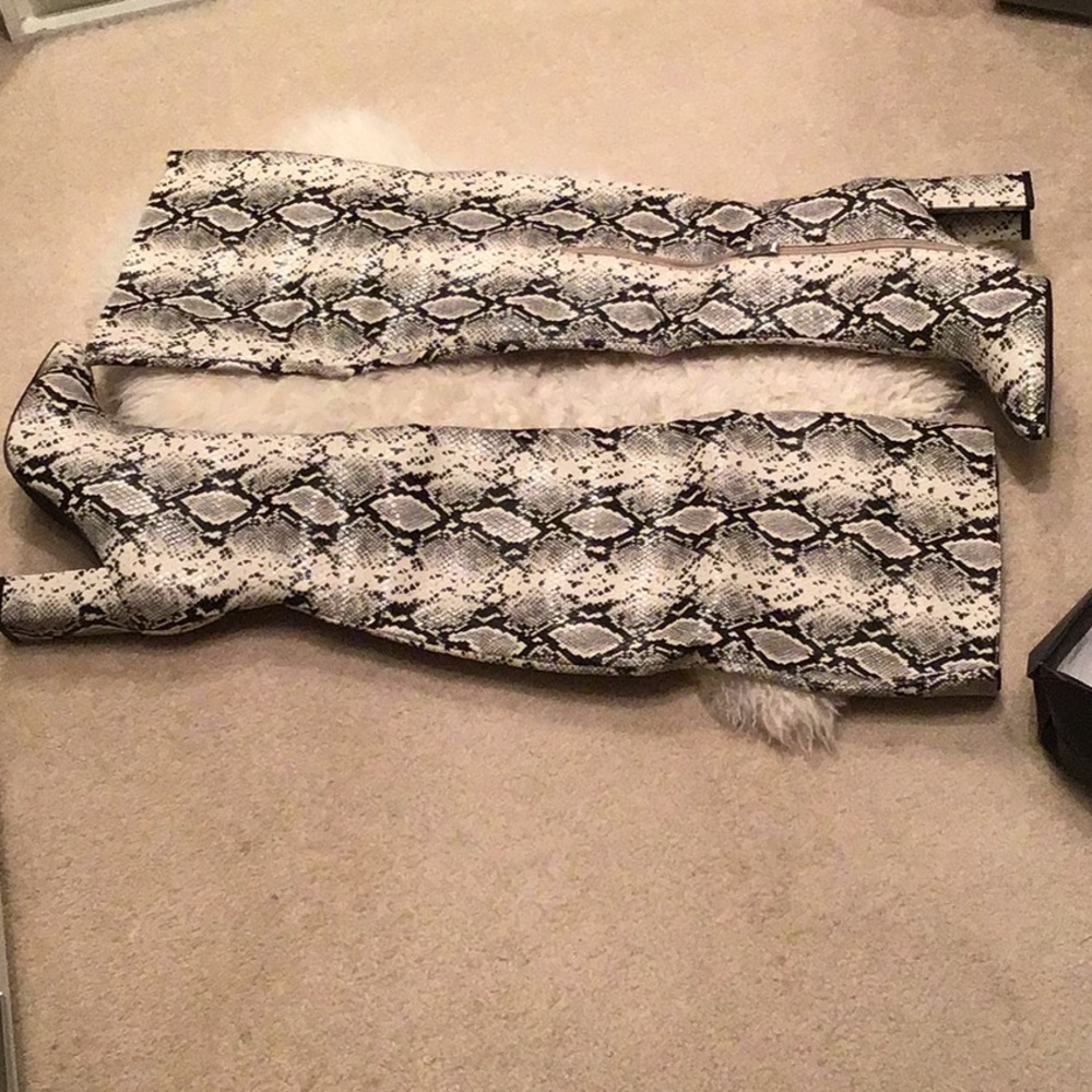 Thigh high snake print boots